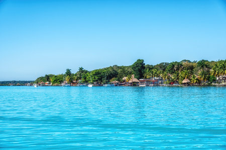 Laguna de Bacalar Lagoon palapas in Mayan Mexico at Quintana rooの写真素材