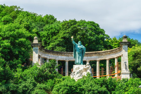 Saint Gellert Bishop with a cross on the Gellert Hill in front of Erzsebet bridge.の写真素材