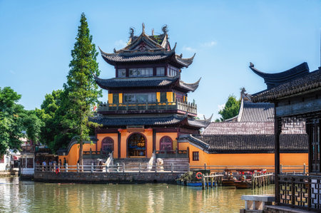Chinese traditional architecture with boats on canal of Shanghai Zhujiajiao water town, Chinaの写真素材