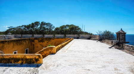 A cannon, a watchtower and a view of the ocean at the Fort of San Miguel, located in Campeche, Mexico.の写真素材