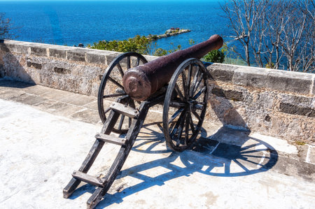 A cannon, a watchtower and a view of the ocean at the Fort of San Miguel, located in Campeche, Mexico.の写真素材