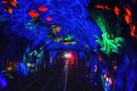 Light show inside Bund sightseeing tunnel (blurred motion) under the Huangpu River, Shanghai, China.