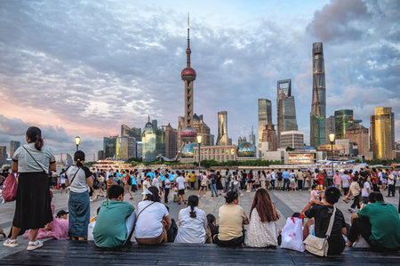 Tourist and People take walking at The Bund in Shanghai. It is a waterfront area which runs along...