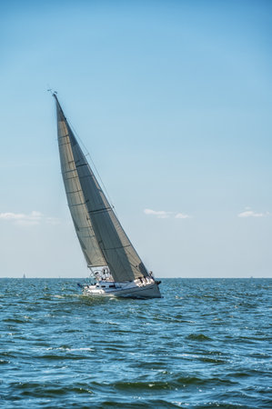 A beautiful shot of a sailship sailing on Markermeer lake against cloudy sky during daytime