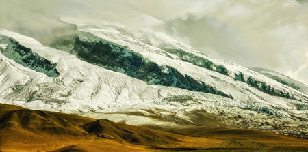 Tashkurgan Muztagh Ata Snow Capped Mountain Peak  at Kala Kule Lake, Xinjiang, China.の写真素材
