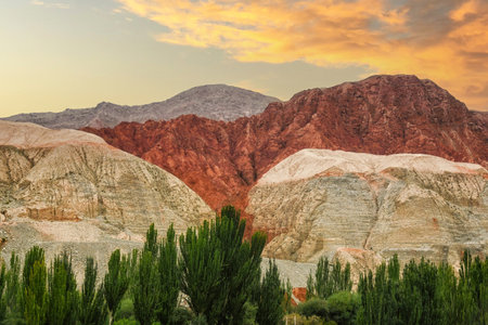 Rock formations, colorful mountains, eroded landscape and Gez river along Karakoram Highway, Xinjiang Autonomous Region, China.の写真素材