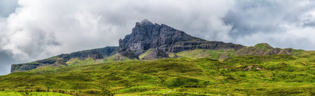 Basalt rock formations and landslip cliffs of Trotternish ridge of the Isle of Skye in Scotland, UK.