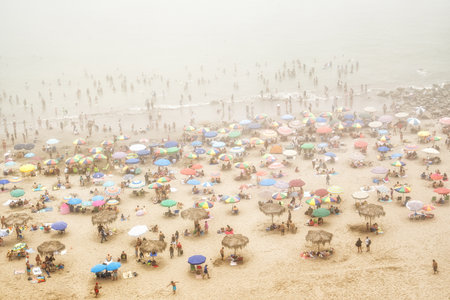 Lima, Peru- August 25th 2025 : Scenic misty view of a busy day on a beach in Mirafloresの写真素材