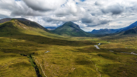 Scenic landscape view of the Black Cuillin mountains and stream at Sligachan on the Isle of Skye,...