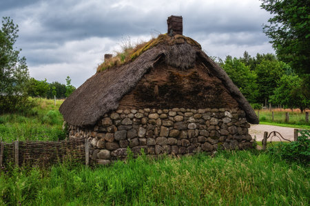Newtonmore, Scotland - 23 July 2025: Thatched Roof Dwelling at the Highland Fold Museum, Scotland UKの写真素材
