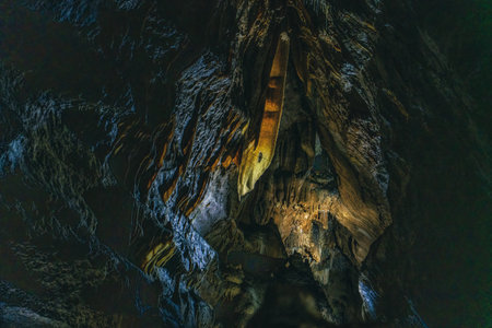 Discover the stunning cave formations of Remouchamps, Belgium featuring beautiful stalactites and...