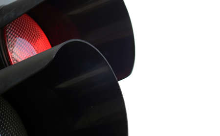 Traffic light - lighting red light - black semaphore on white bacgroundの写真素材