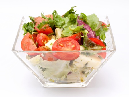 Vegetable salad with cheese, green salad, with cherry tomatoes, fetta cheese, red onion, and mixed greensの写真素材