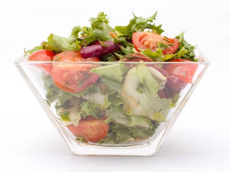 Vegetable salad with cheese, green salad, with cherry tomatoes, fetta cheese, red onion, and mixed greensの写真素材
