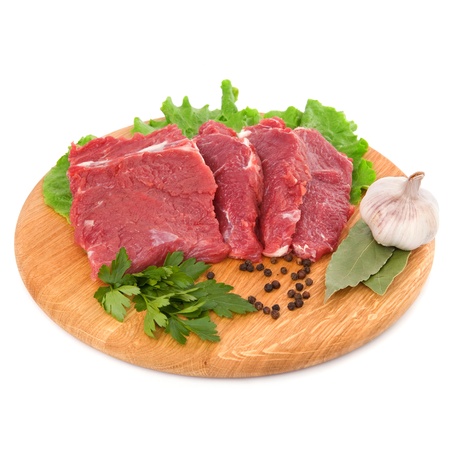 fresh raw beef steak meat on cutting board in closeup over white backgroundの写真素材