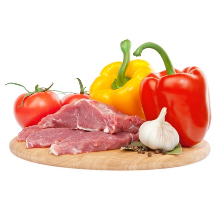 raw meat with peppers, tomatoes and garlic ingredientsの写真素材