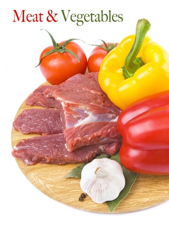 raw meat with peppers, tomatoes and garlic ingredientsの写真素材