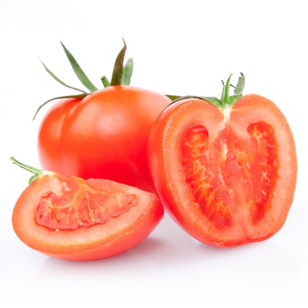 fresh red tomato with cut isolated on whitの写真素材