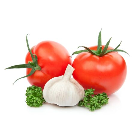 Fresh Tomato Vegetables to garlic decorated with parsley isolated on whiteの写真素材