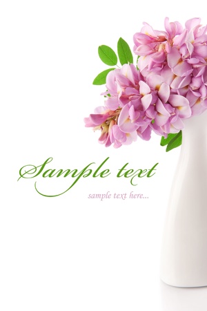 Beautiful pink flowers in white vaseの写真素材