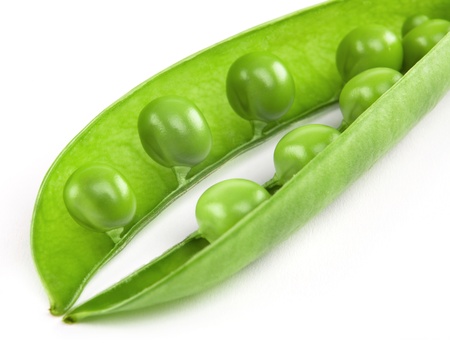 fresh peas isolated on white backgroundの写真素材