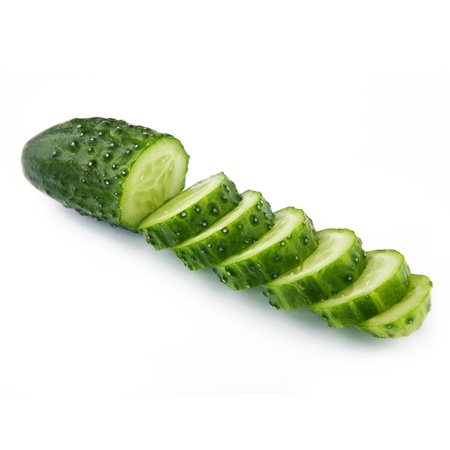 Cucumber and slices isolated over white background.の写真素材