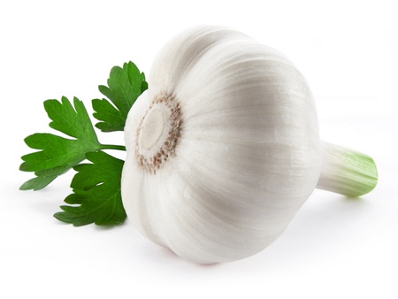 garlic decorated parsley leaves isolated on white backgroundの写真素材