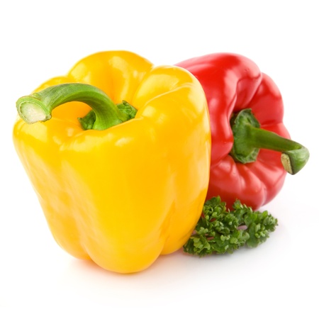 Yellow And Red Peppers decorated with greeneryの写真素材