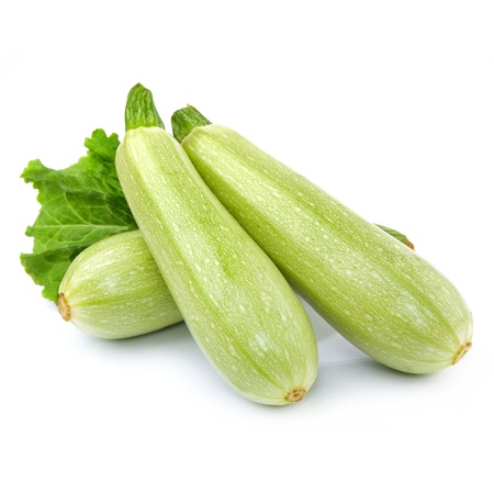 Fresh vegetable marrow decorated with green leaf lettuce. Isolated on whiteの写真素材