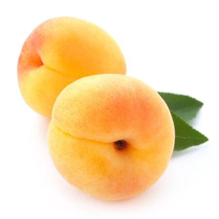 Apricot fruits with leaves isolated on white background
の写真素材