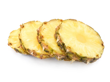 Ripe half pineapple with lush green leavesの写真素材