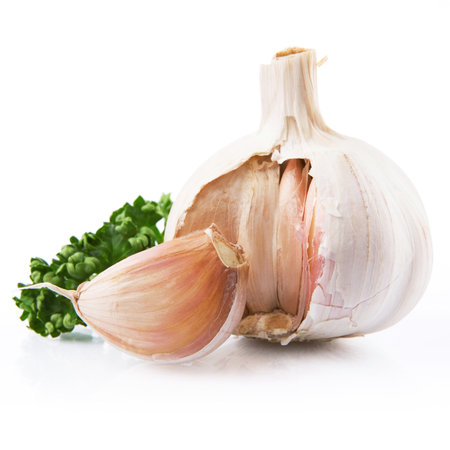 garlic decorated parsley leaves isolated on white backgroundの写真素材