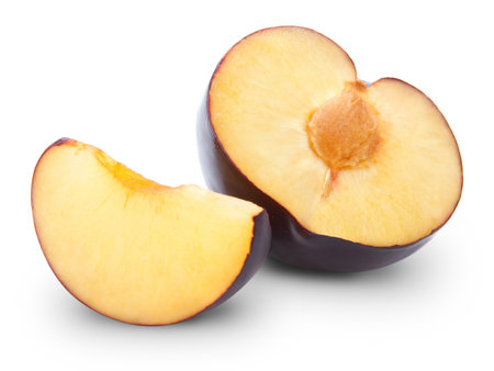 plums half isolated on white の写真素材