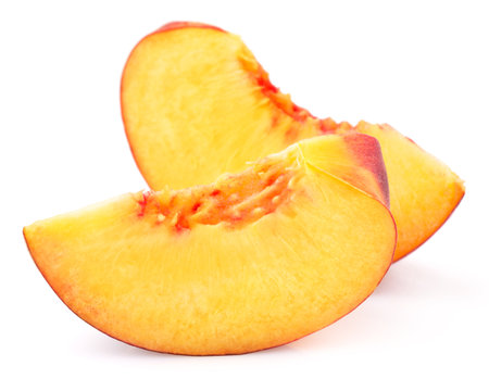 peach slice isolated on white backgroundの写真素材