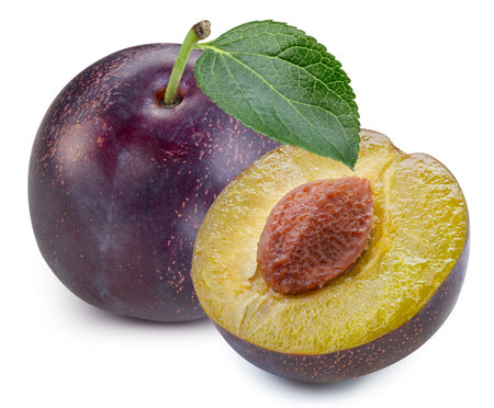 Plums half with leaves isolatedの写真素材
