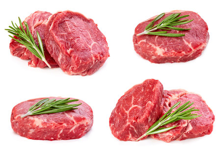 Beef steak with leaf rosemary isolated on whiteの写真素材