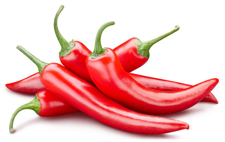Fresh red peppers isolated on white background. Red hot natural chili pepper clipping path. Fresh organic fruit. Full depth of fieldの写真素材