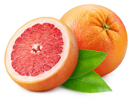 Whole grapefruit and half with leaf isolated on white background.の写真素材