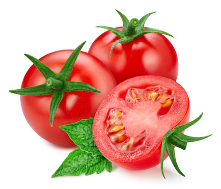 Ripe whole tomato vegetable with green leaf and half isolated on whiteの写真素材