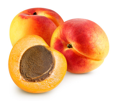 Whole and half apricot on white background. Apricot isolated on white background. Taste apricot full depth of fieldの写真素材