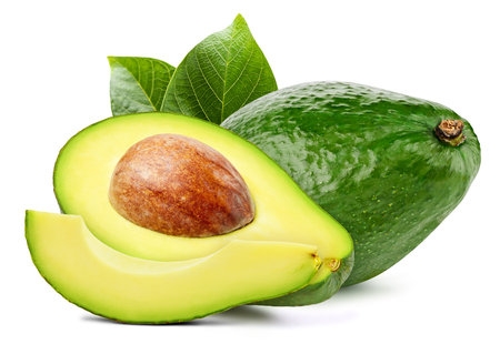 Isolated avocado. Fresh organic avocado with leaves isolated clipping path. Avocado macro studio photo.の写真素材