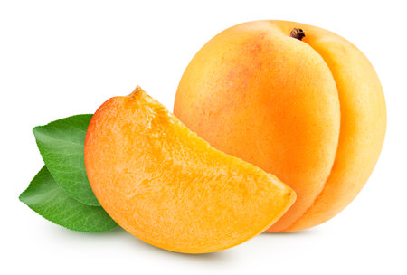 Whole and slice apricot on white background. Apricot isolated on white background. Apricot with leavesの写真素材