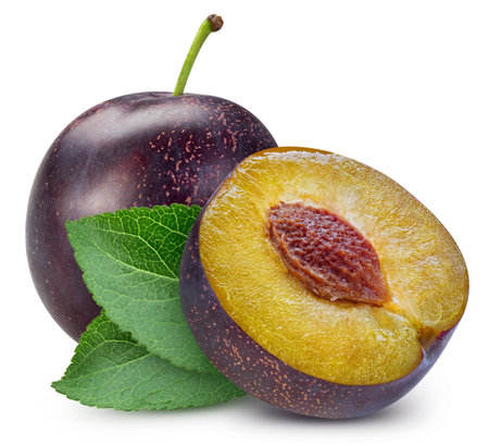 Plum fruit with cut in half and green leaves isolated on white background. Clipping path plum. Plum macro studio photoの写真素材