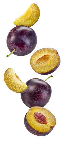 Flying plum isolated on the white background. plum half. Fresh plum fruits isolated on white backgroundの写真素材