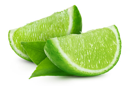 Lime with a leaf fruit with slice isolated on white background.の写真素材