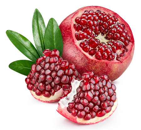 Pomegranate with leaves isolated on white background. Pomegranate Clipping Path. Pomegranate macro studio photoの写真素材