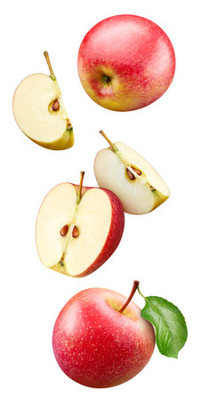 Red apple with apple slice and leaves isolated on a white background. Apple with leaves clipping path. Flying in air appleの写真素材