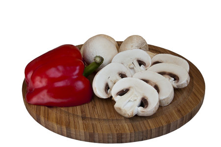 mushrooms and red pepper on a cutting boardの写真素材