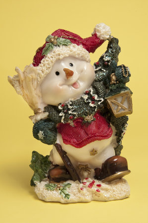 toy snowman on a yellow backgroundの写真素材