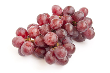 bunch of red grapes on white backgroundの写真素材